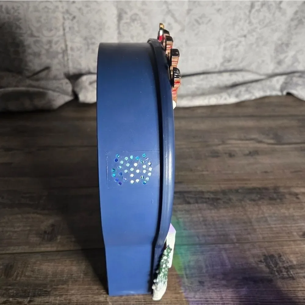 Two snow globes, animated snow, one is musical  and lights up htf